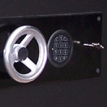 Safe closed with a key and electronic lock.